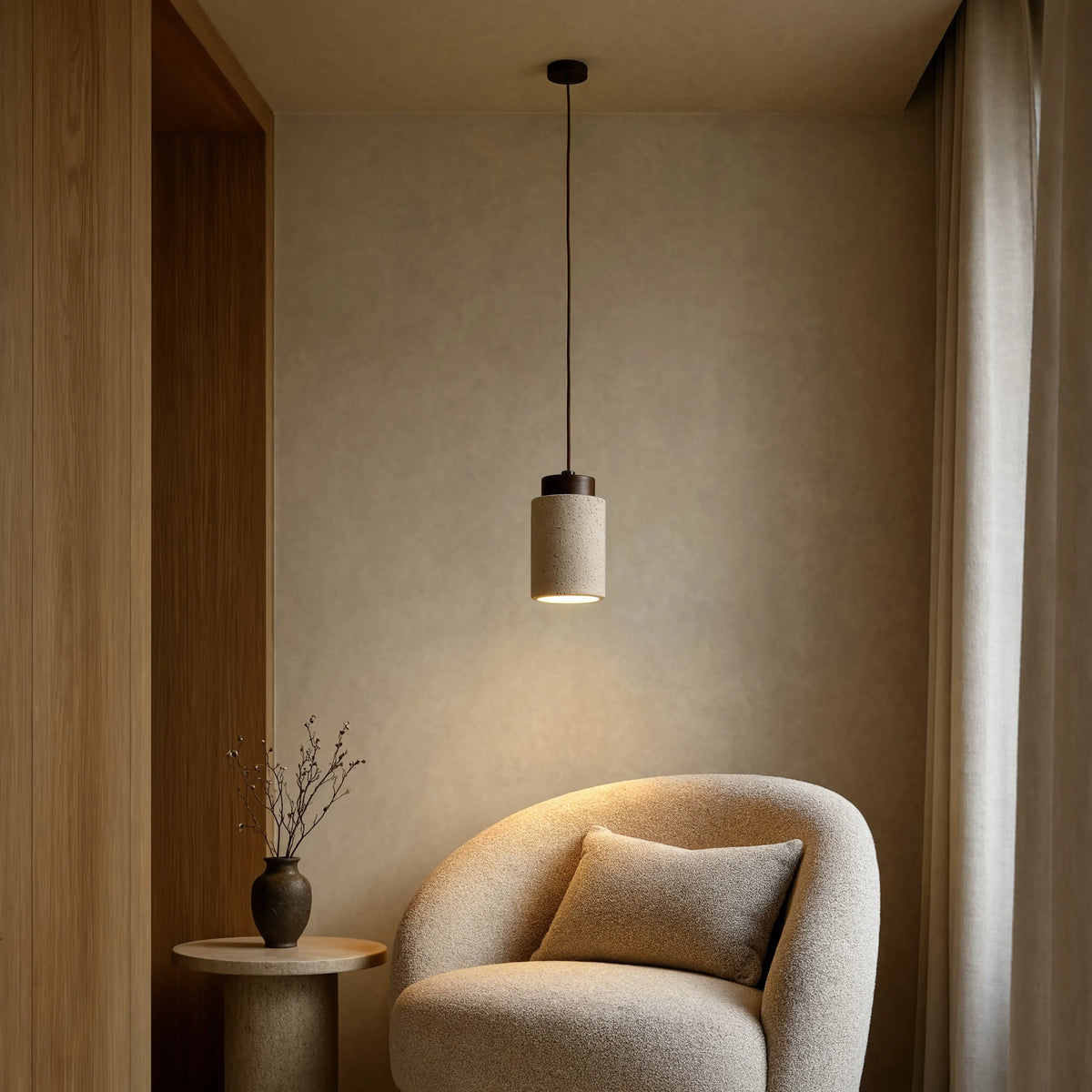 Paestum travertine cylinder pendant light with dark wood cap – shown in a room setting