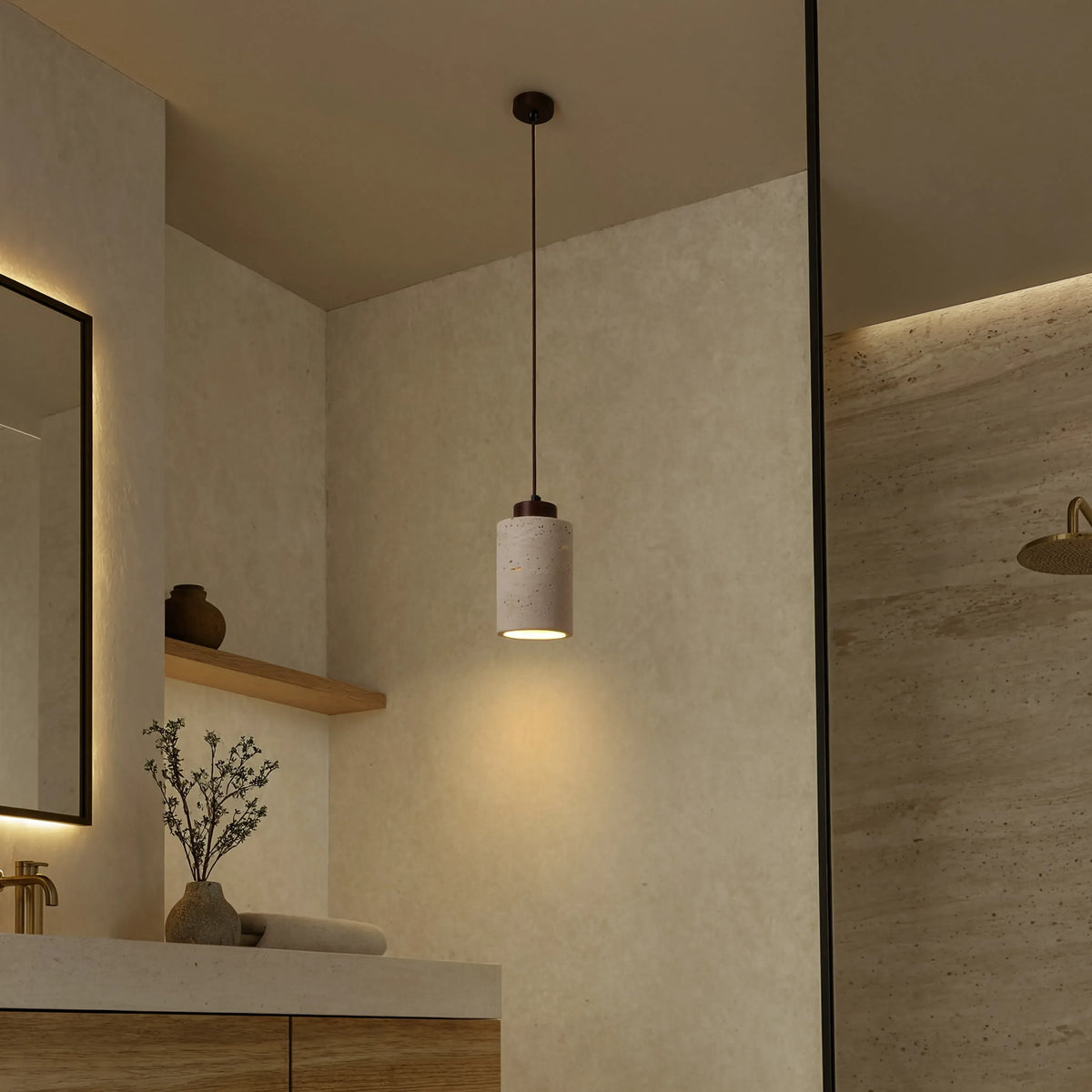 Paestum travertine cylinder pendant light with dark wood cap – shown in a bathroom