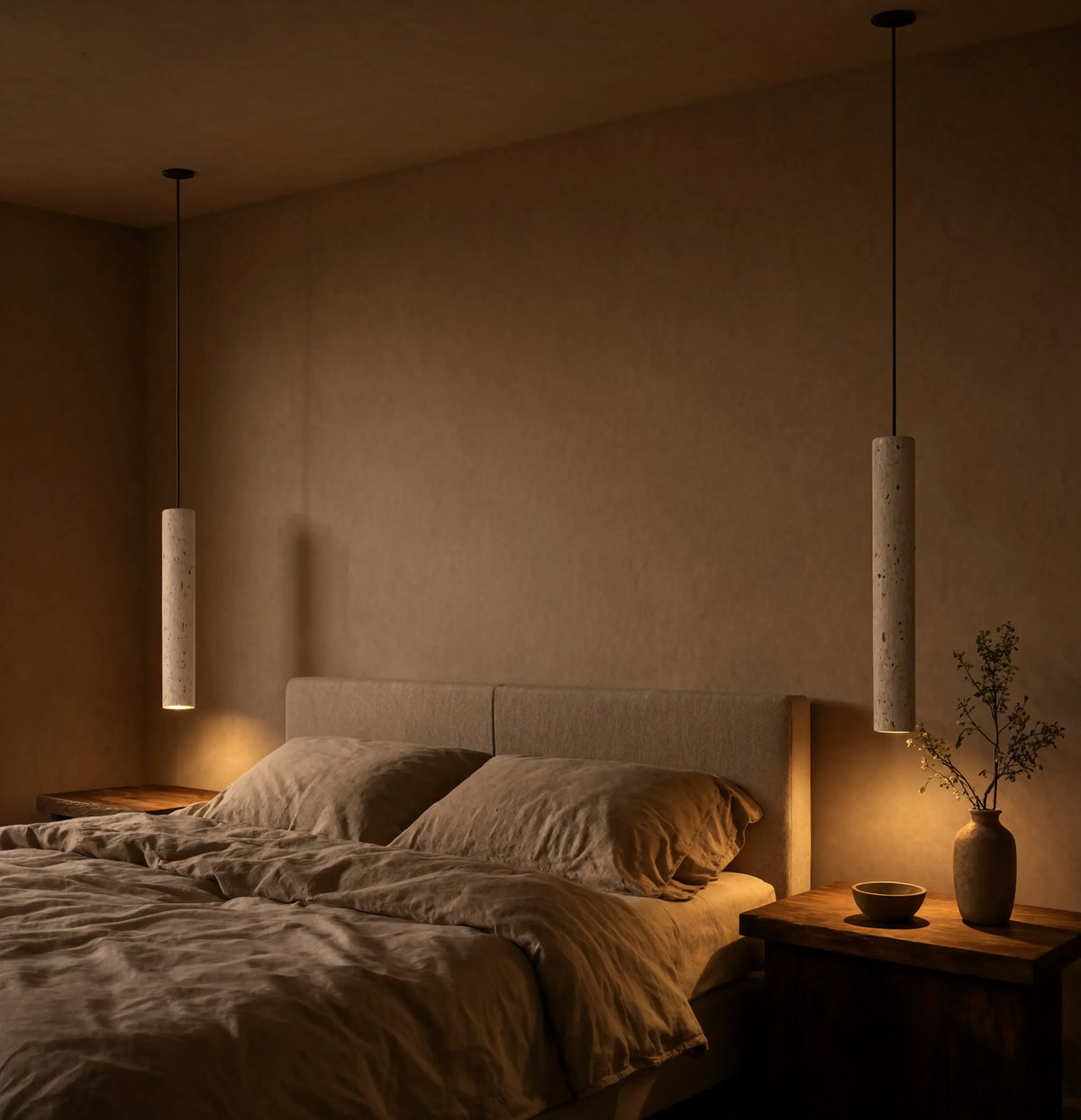 Cumes long travertine tube pendant light – shown in a bedroom