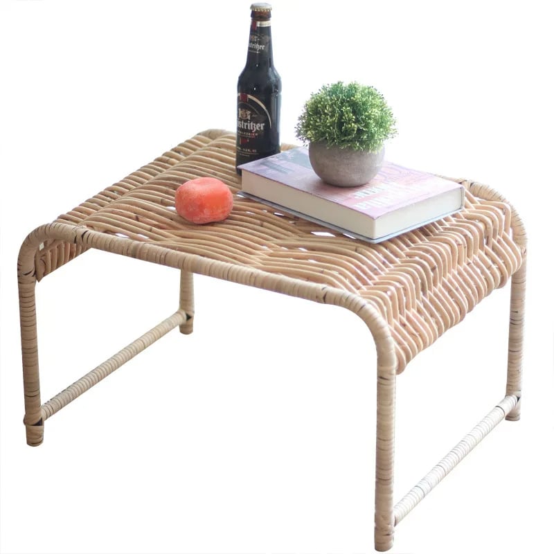 Rectangular wicker coffee table on natural wood legs
