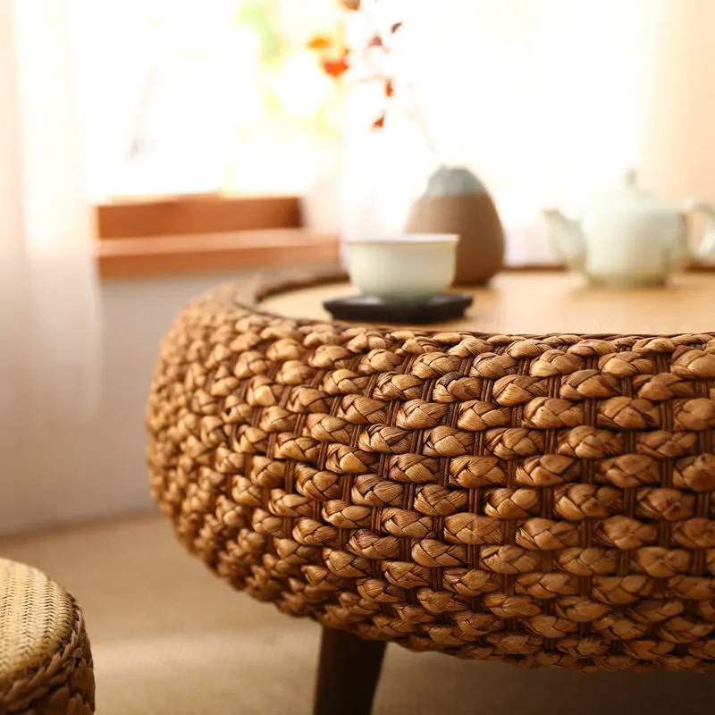 Round handwoven wicker coffee table with an interwoven base – close-up detail