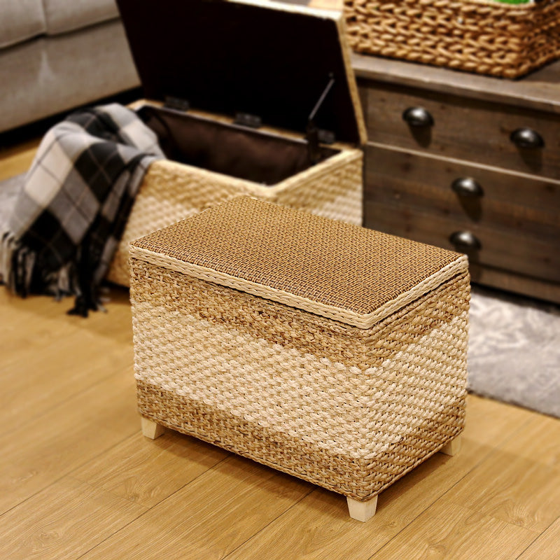 Rectangular hand-braided rattan storage stool with a removable lid – shown in a room setting (3)
