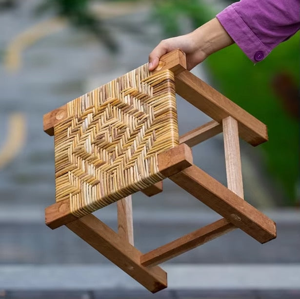 Handmade square wicker stool on a solid wood frame – shown in use