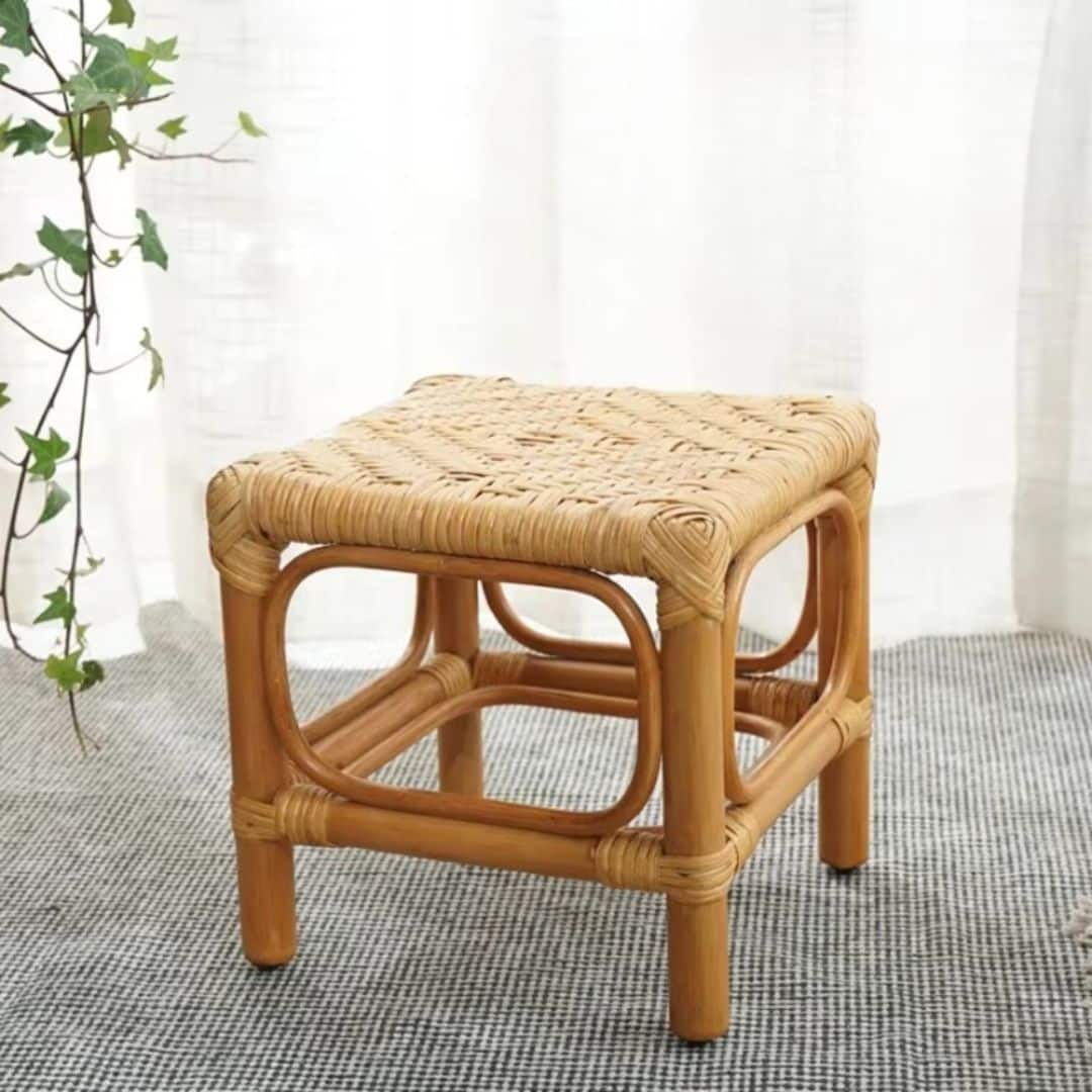 Square Nordic wicker stool with a tight hand braid