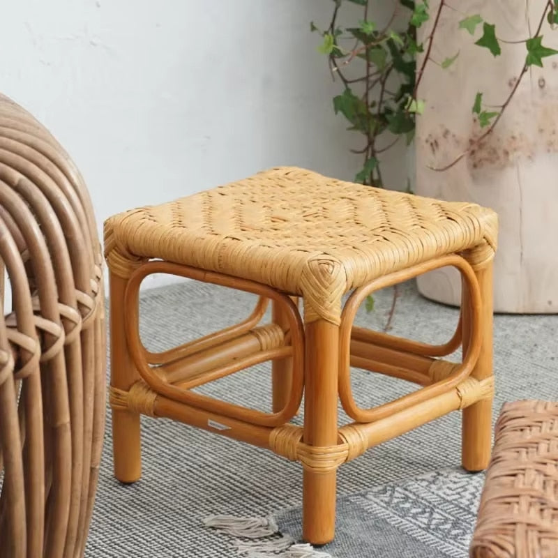 Square Nordic wicker stool with a tight hand braid – shown in a room setting