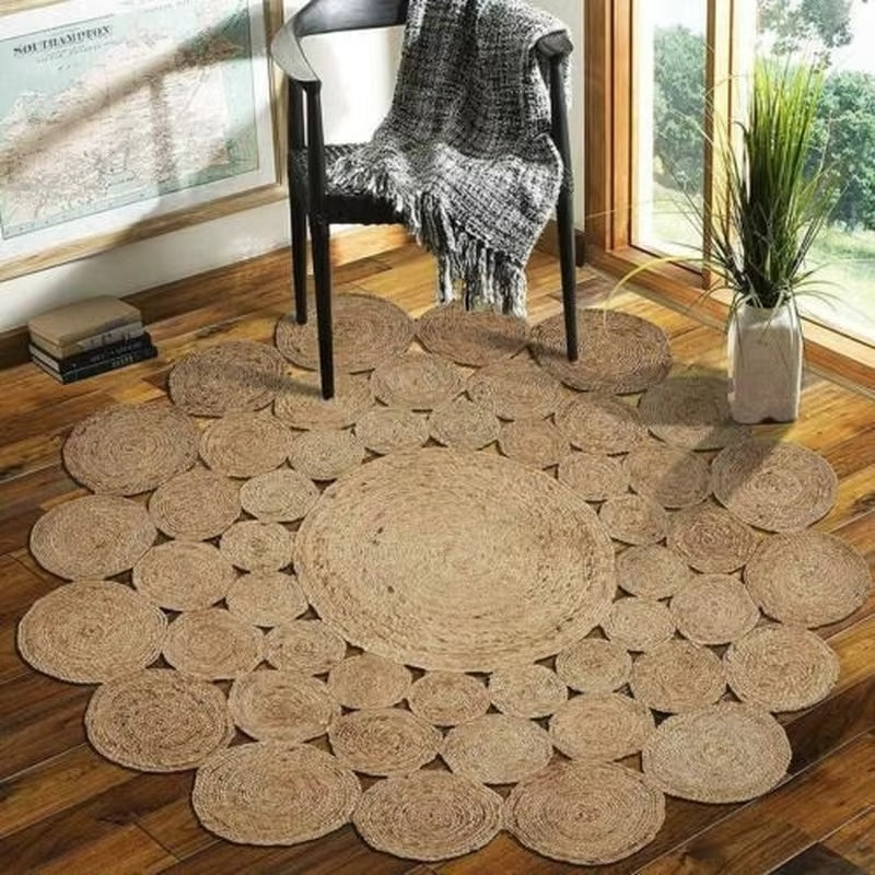 Round wicker rug with handwoven concentric circles – shown in a room setting
