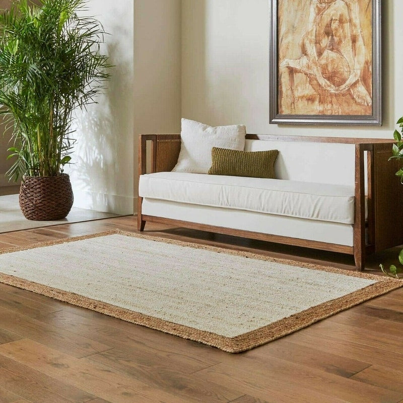 Rectangular white and beige handwoven rug – shown in a room setting (2)