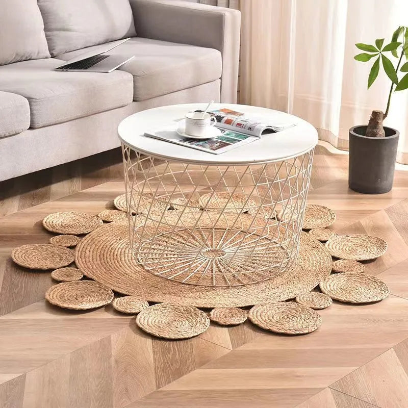 Round rattan rug with a scalloped edge of raised circles – shown in a room setting