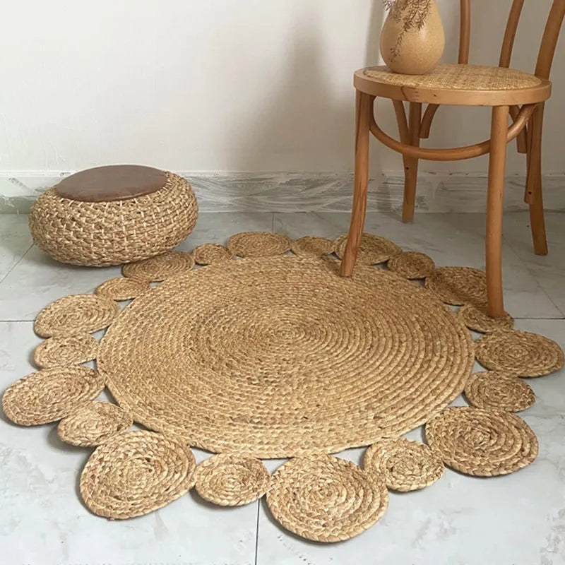 Round rattan rug with a scalloped edge of raised circles – shown in a room setting (2)