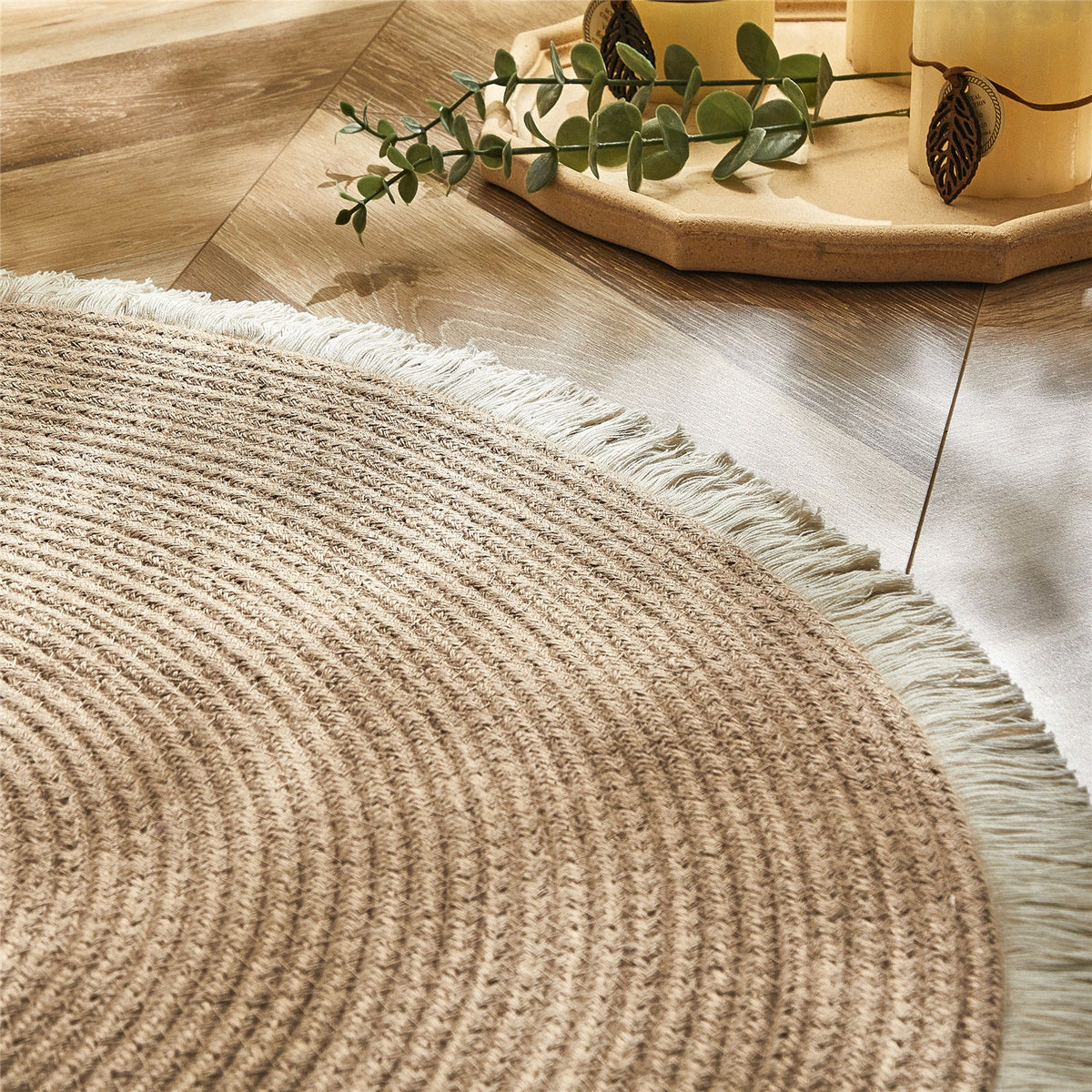 Round two-tone PE rattan rug – shown in a room setting (3)