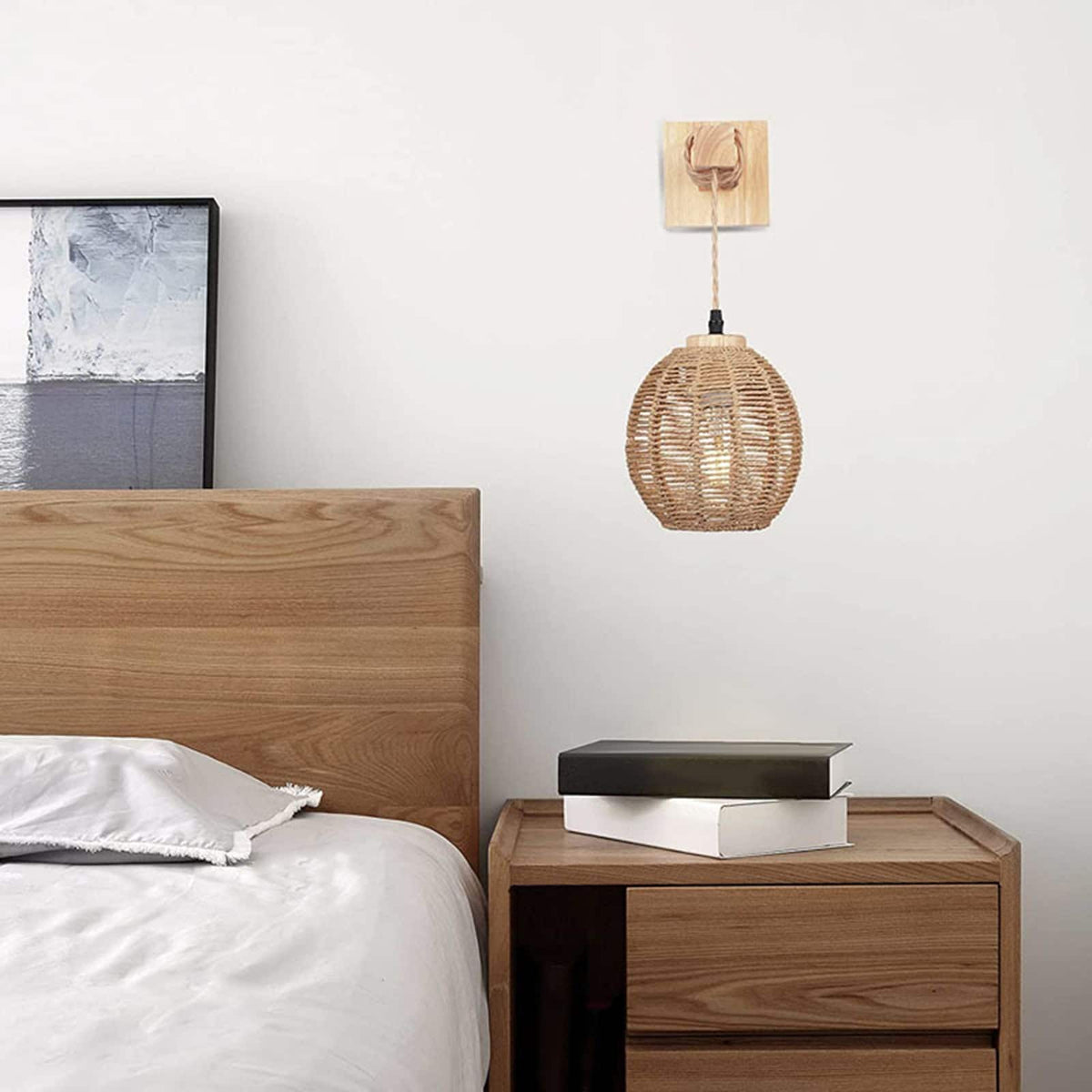 Hanging handwoven rattan ball wall light – shown in a room setting
