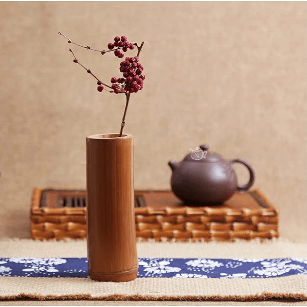 Chinese-inspired handwoven bamboo vase with geometric motifs – shown in a room setting (2)