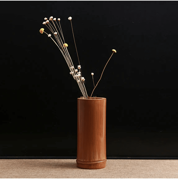 Chinese-inspired handwoven bamboo vase with geometric motifs – shown in a room setting