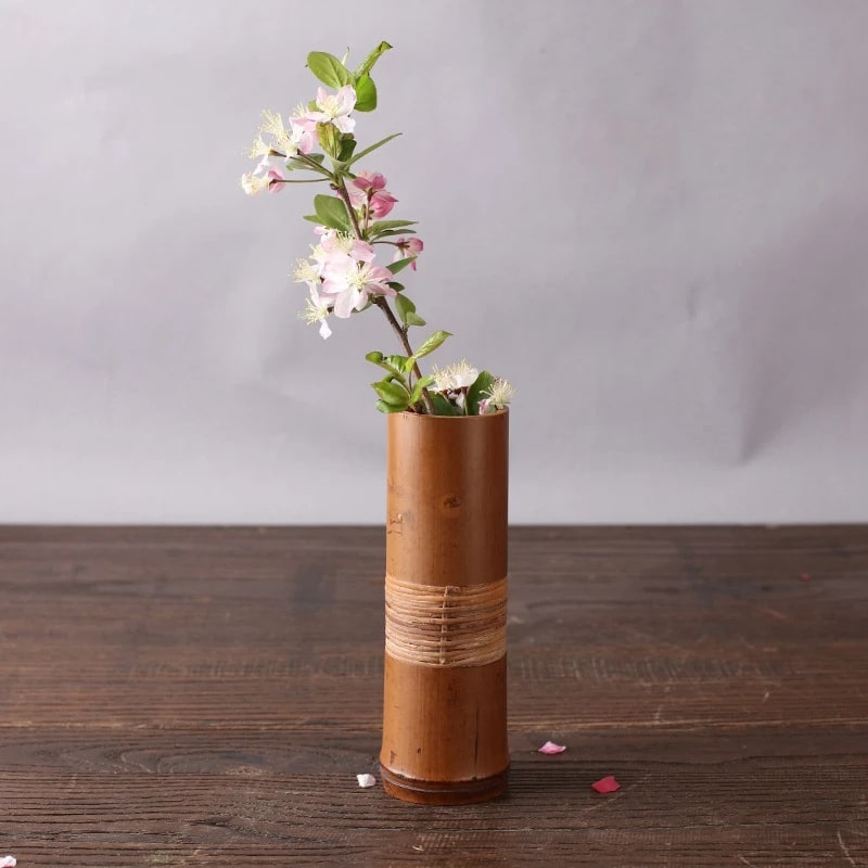 Vintage-style cylindrical bamboo vase – shown in a room setting