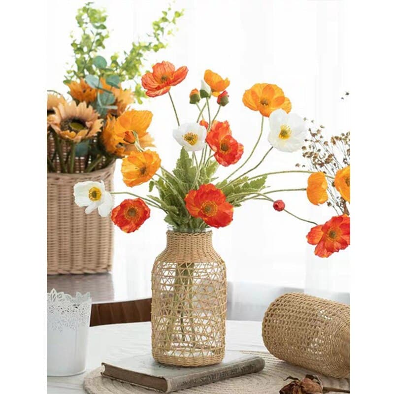 Blown glass vase with a handwoven triangle-pattern sleeve
