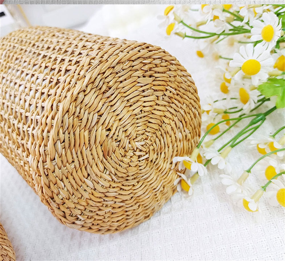 Slender hand-braided rattan vase with a clear glass liner – close-up detail