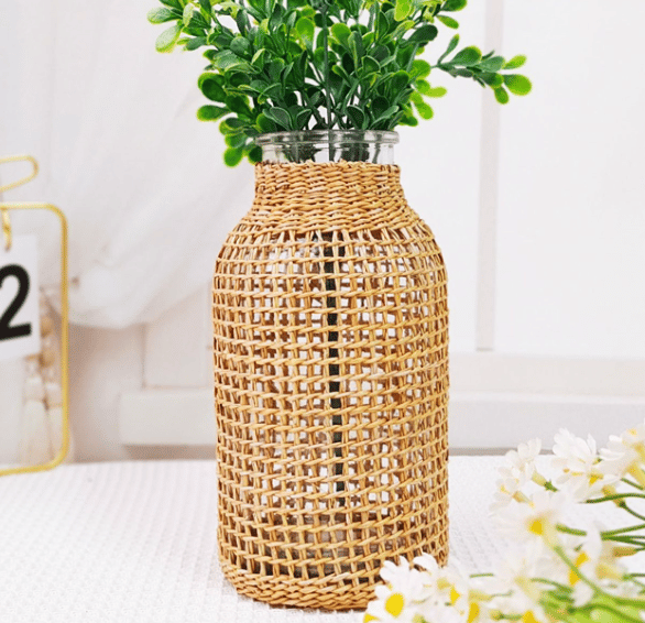 Slender hand-braided rattan vase with a clear glass liner