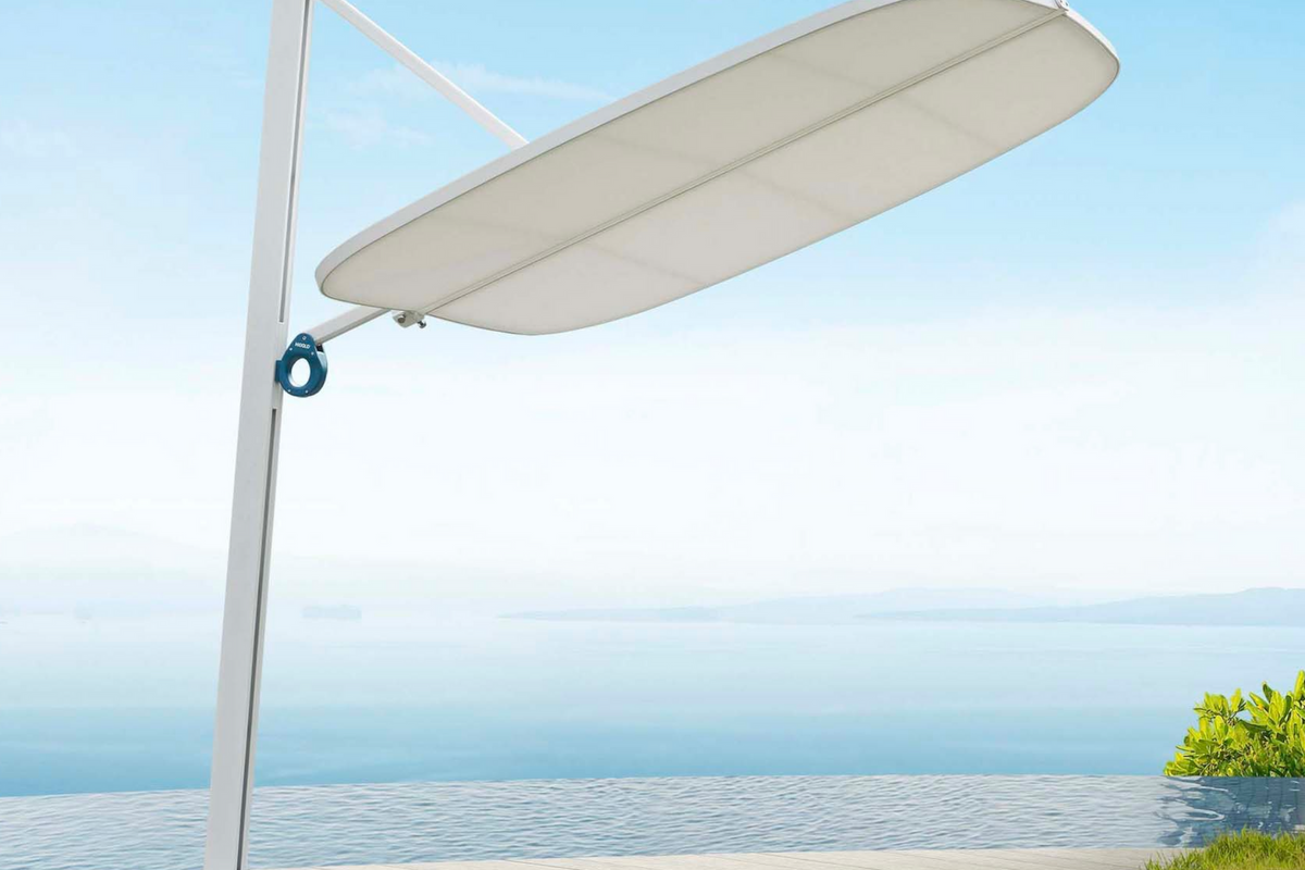 Alice white aluminum offset umbrella with acrylic canopy – shown outdoors