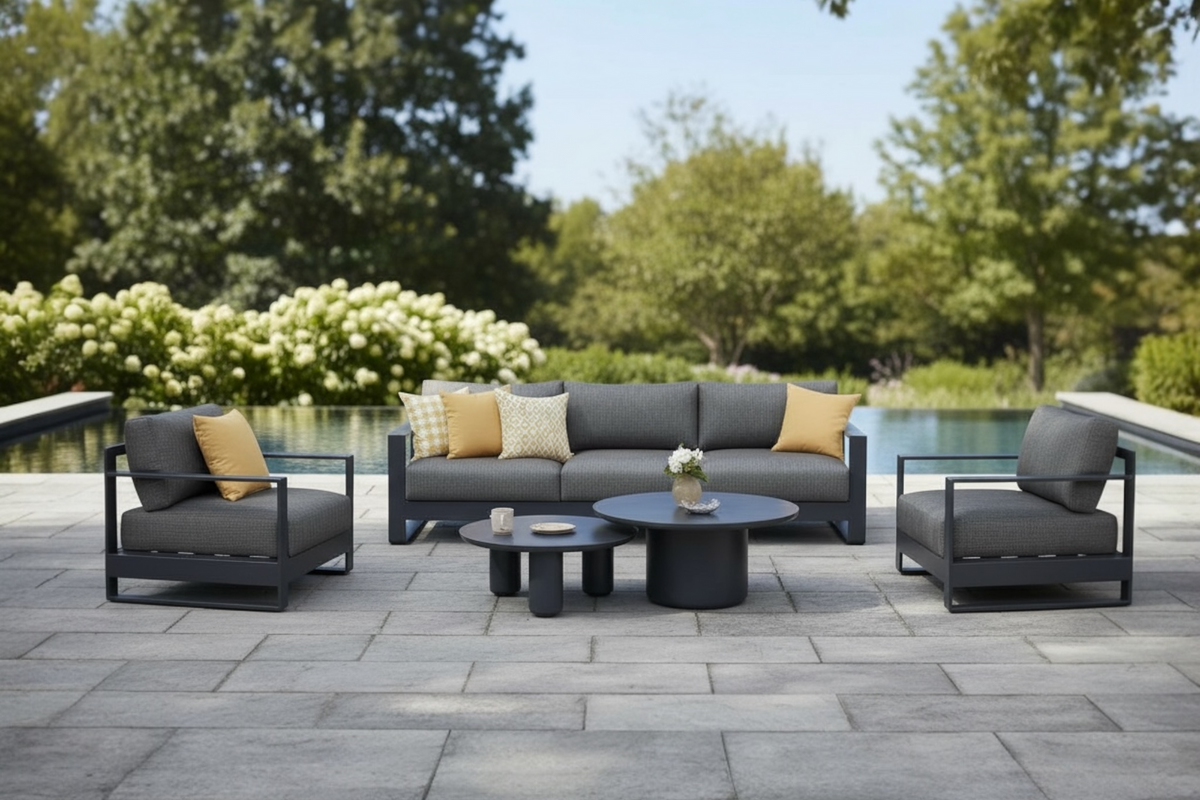 Iris Bis black modular aluminum patio set with gray cushions and ceramic tables – shown outdoors