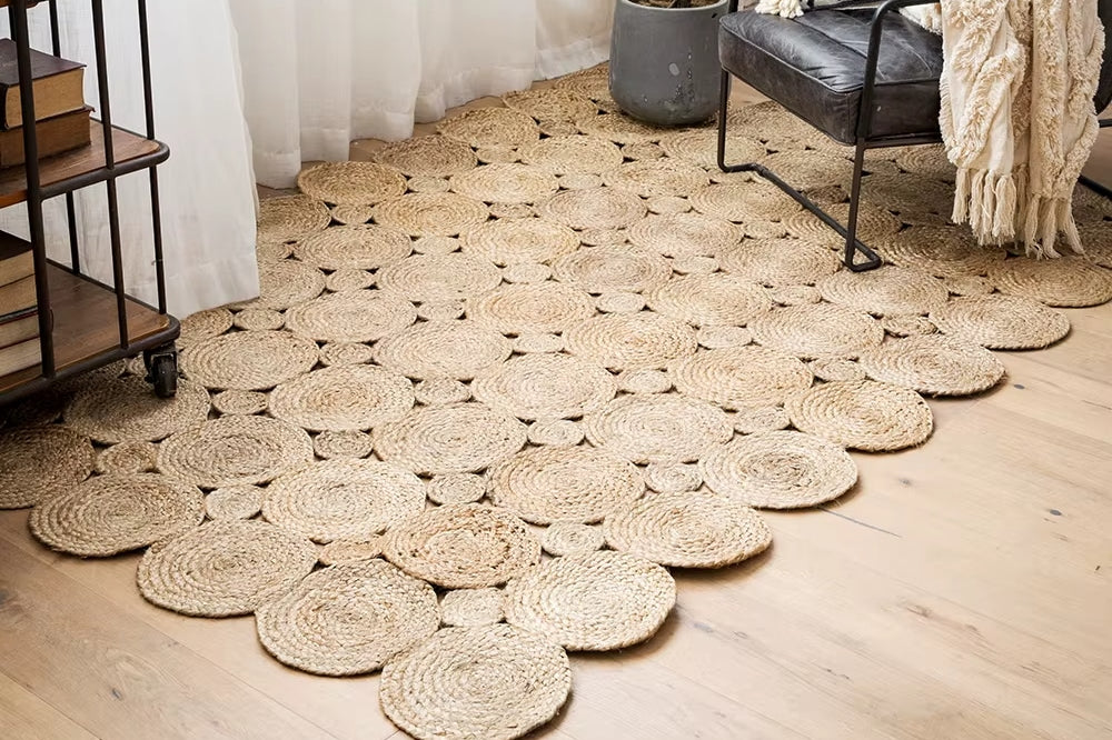 Large undyed natural jute rug with concentric circles – shown in a room setting