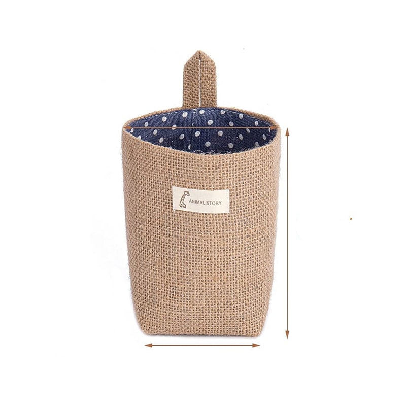 Woven hanging wall storage basket shaped like a bag