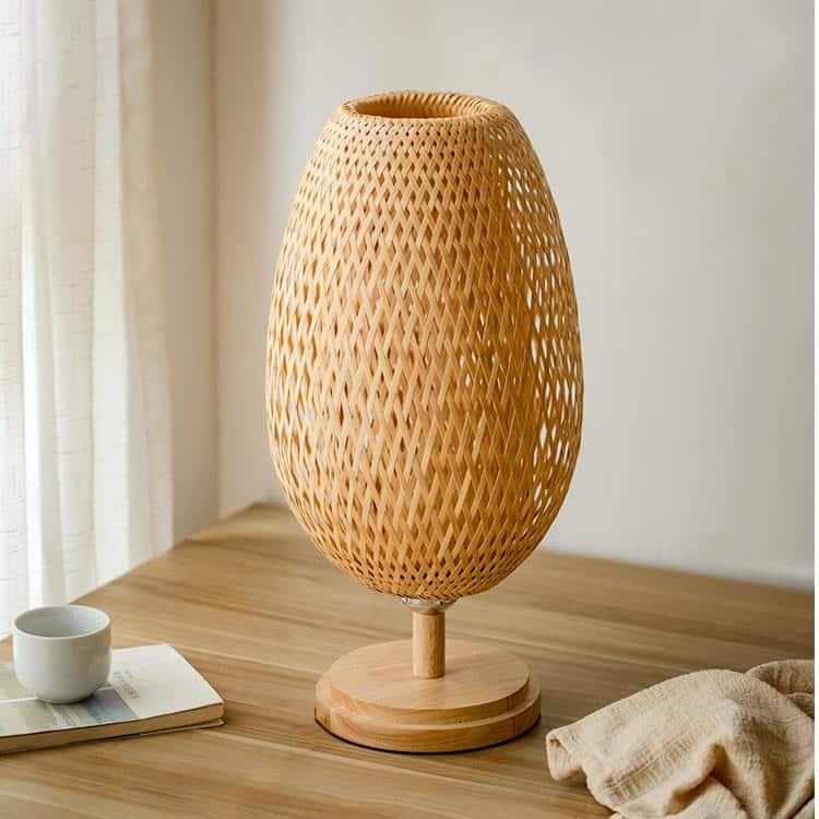 Handwoven natural rattan table lamp – shown in a room setting