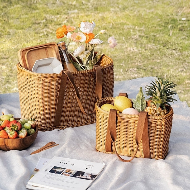 Woven picnic basket with soft, flexible handles – shown in a room setting