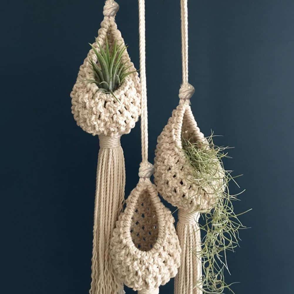 White woven cotton hanging planter basket – shown in a room setting