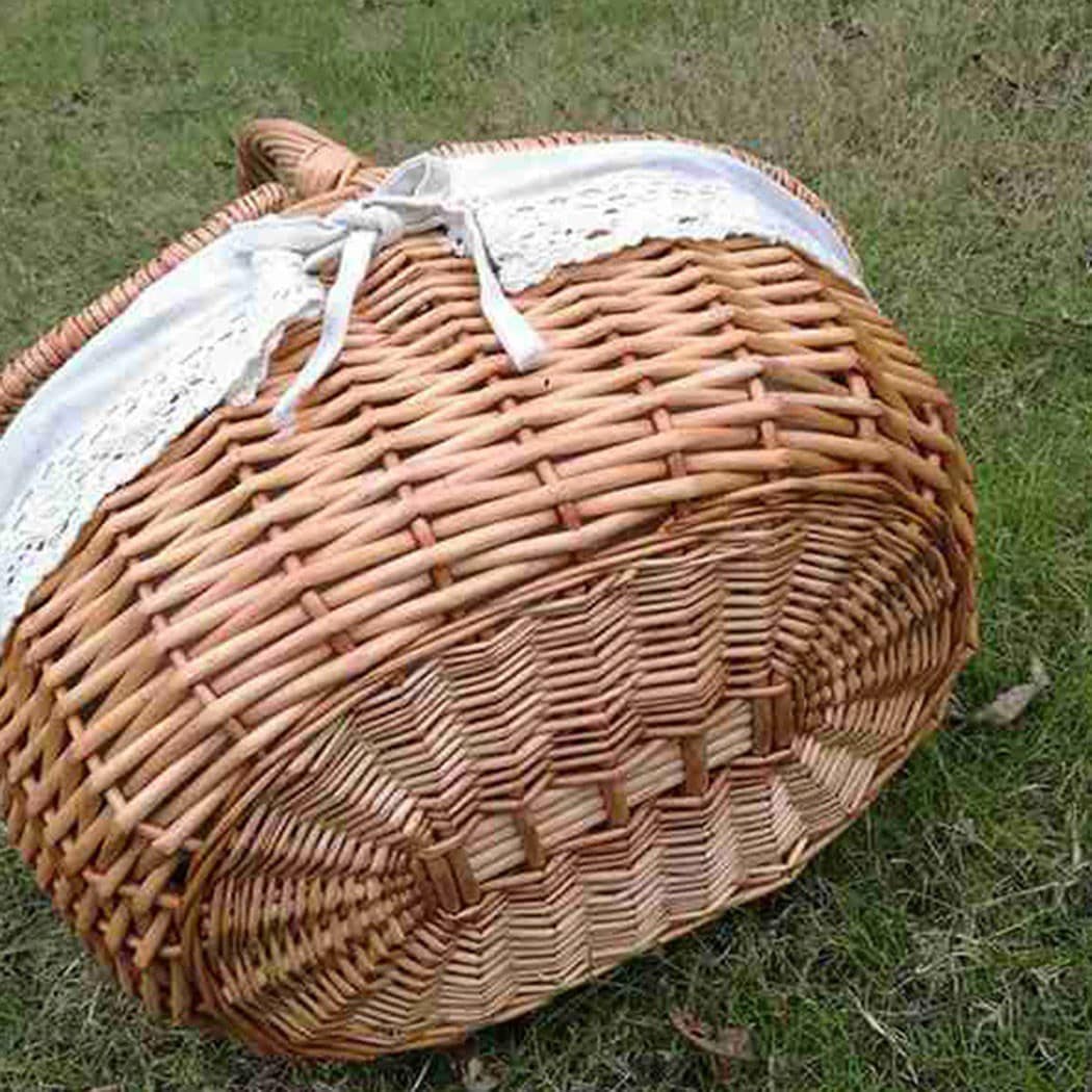 Woven rattan basket with a flip lid – shown outdoors