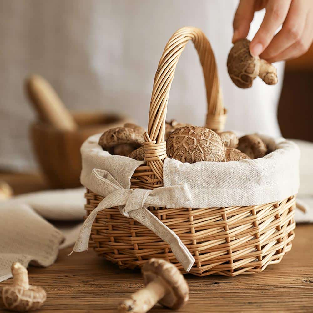 Woven storage basket with a handle and beige fabric lining – shown in use (3)