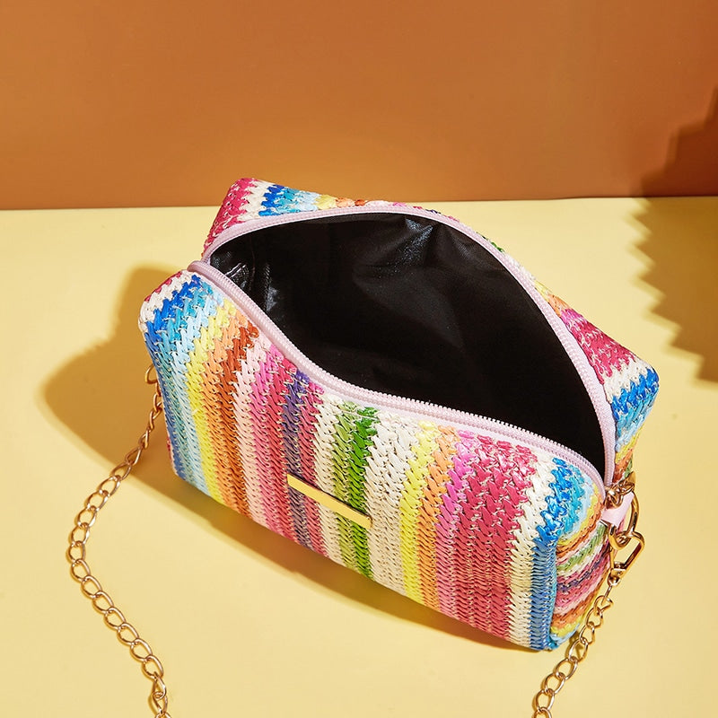 Small multicolor rattan handbag with bold color bands – close-up detail