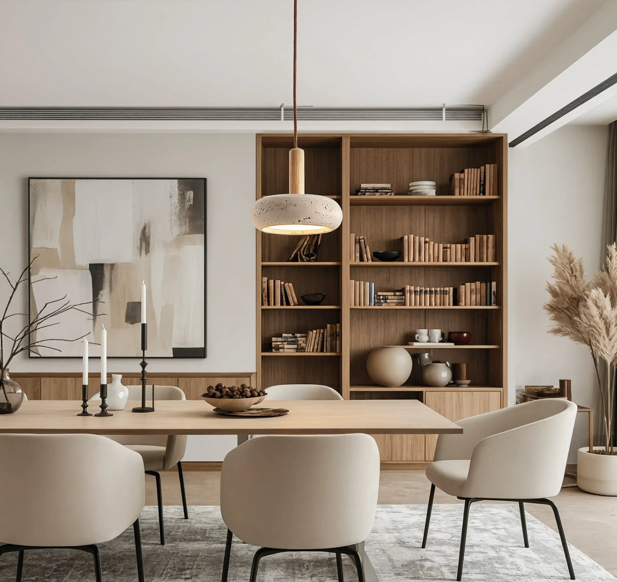 Nora low-profile travertine and light wood pendant light – shown in a room setting (2)