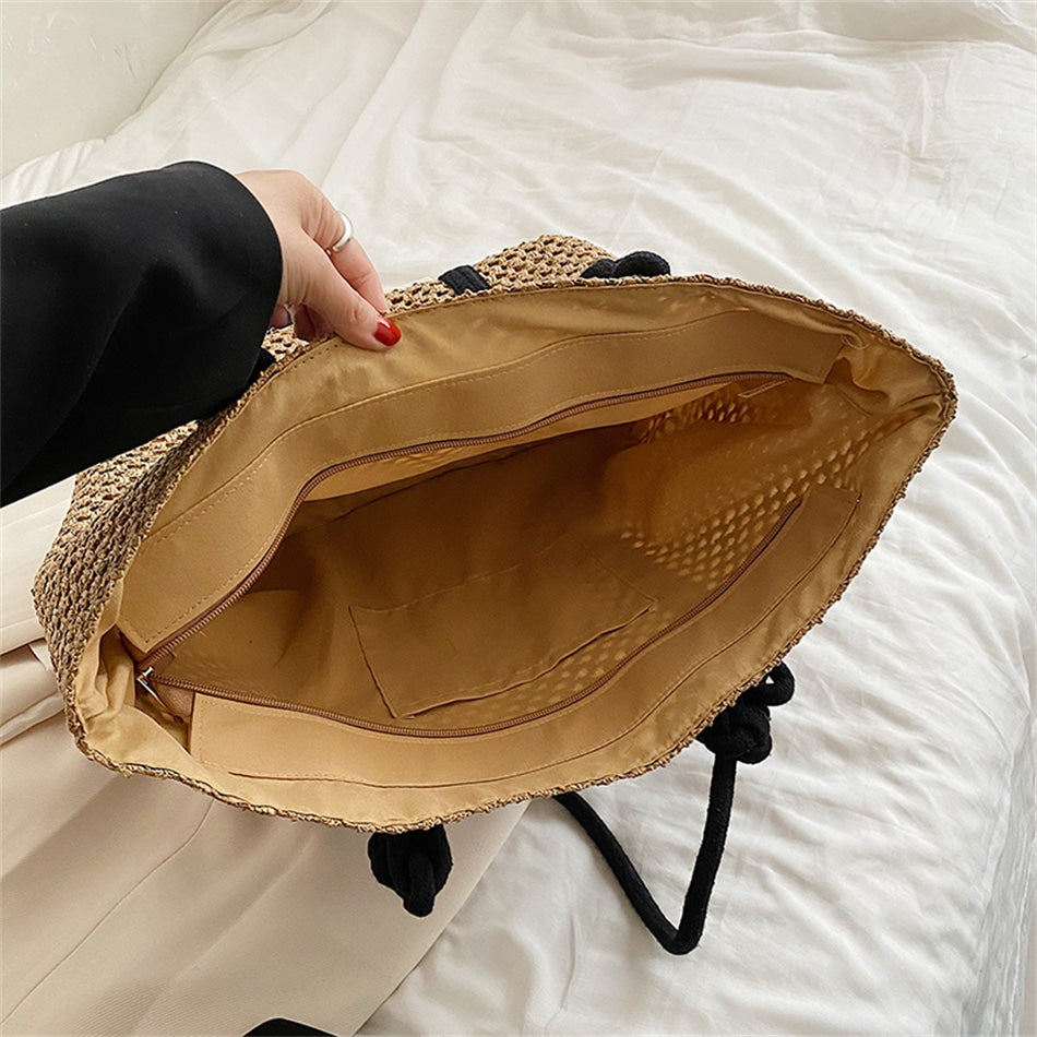 Woven straw handbag with handles – close-up detail