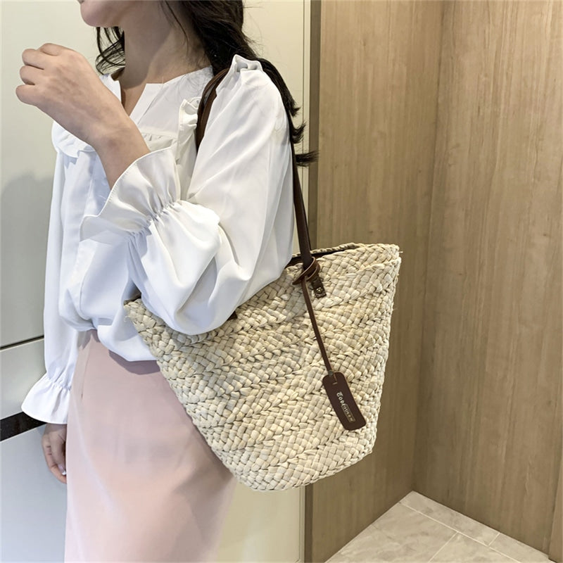Boho handwoven straw handbag – worn by a model (3)