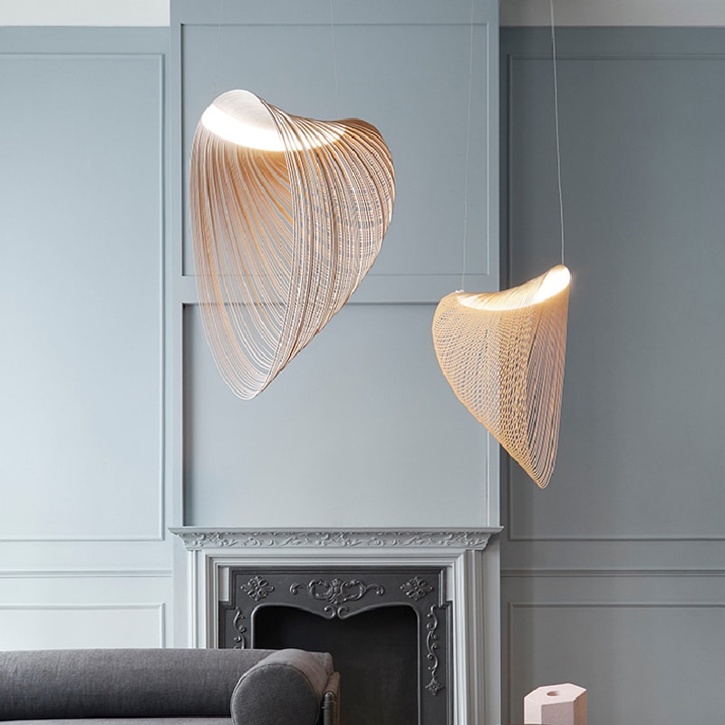 Futuristic geometric wood blade pendant light – shown in a room setting