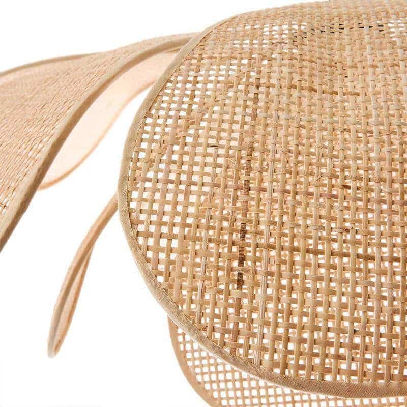 Minimalist handwoven rattan flower pendant light with geometric petals – close-up detail