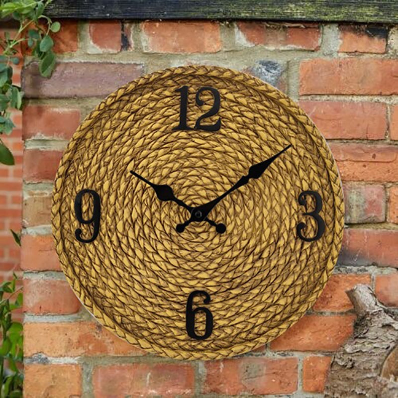 Outdoor rattan-look wall clock – shown outdoors