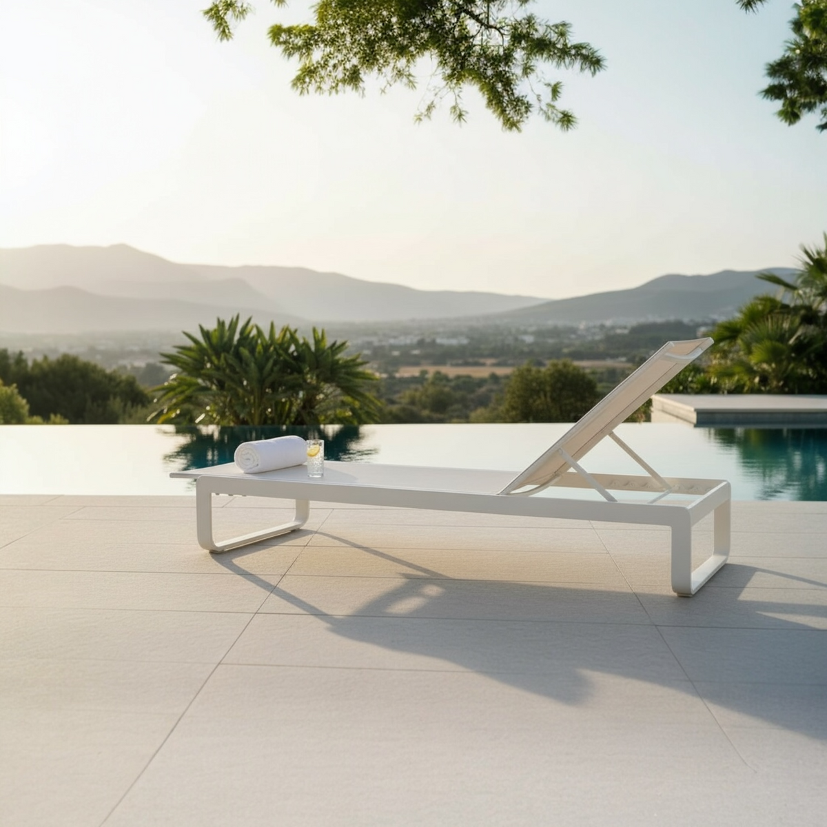 Romy all-white aluminum textilene chaise lounge – shown outdoors