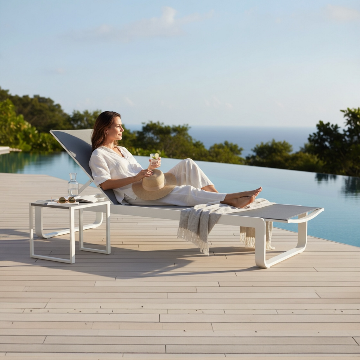 Romy white aluminum chaise lounge with gray textilene – shown outdoors (2)