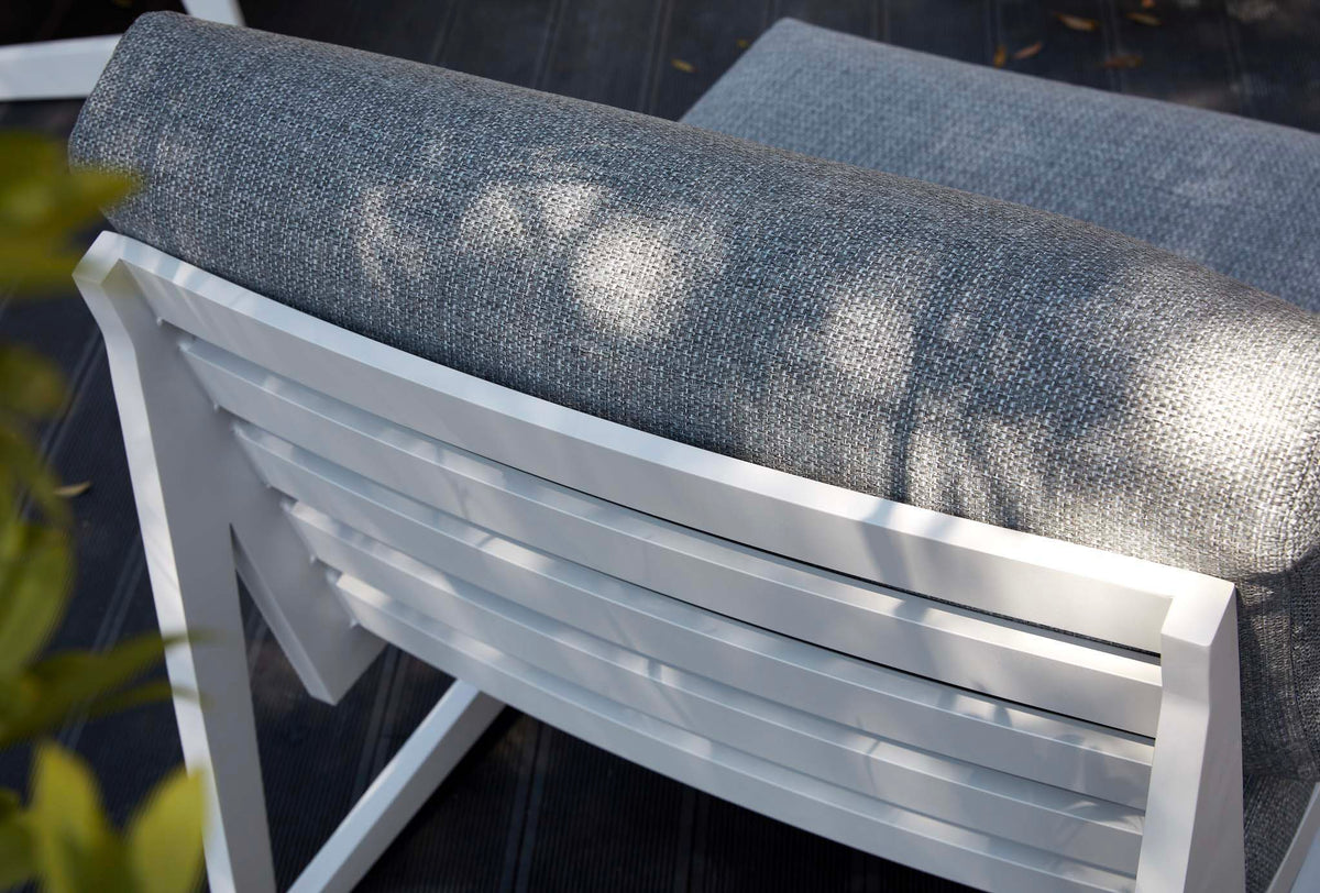 Leo white aluminum patio set with gray olefin cushions and round teak coffee table – close-up detail