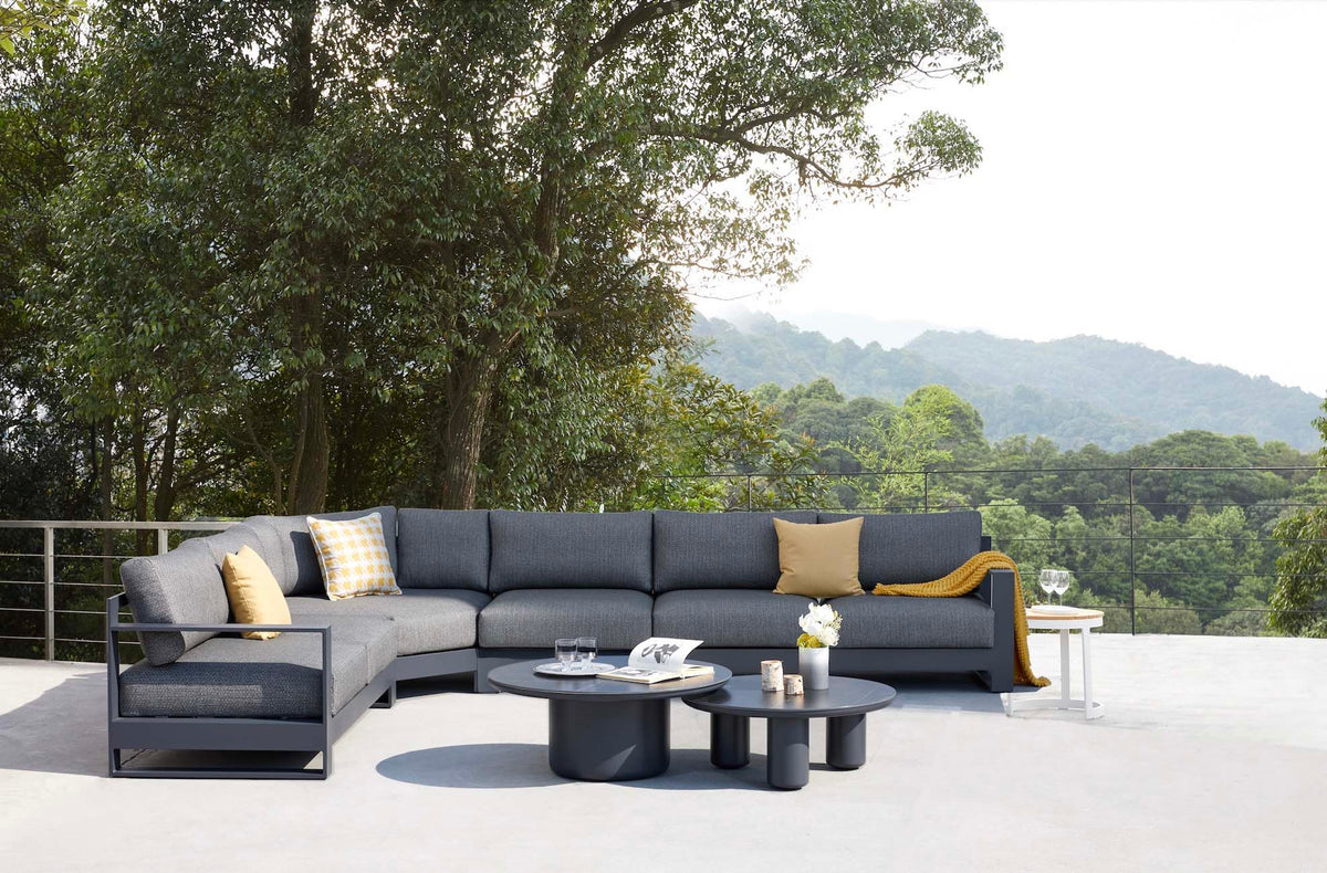 Iris Cosy black aluminum outdoor sectional with two ceramic coffee tables – shown outdoors (3)