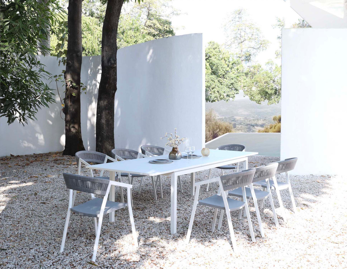 Lou white extendable aluminum outdoor dining table – shown outdoors (3)