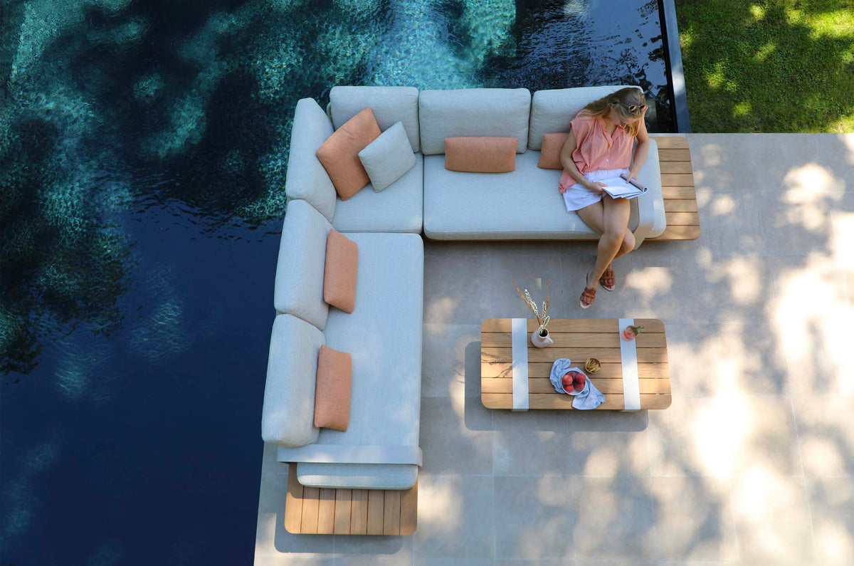 Romeo beige aluminum outdoor sectional with sculpted teak armrests – shown outdoors (2)