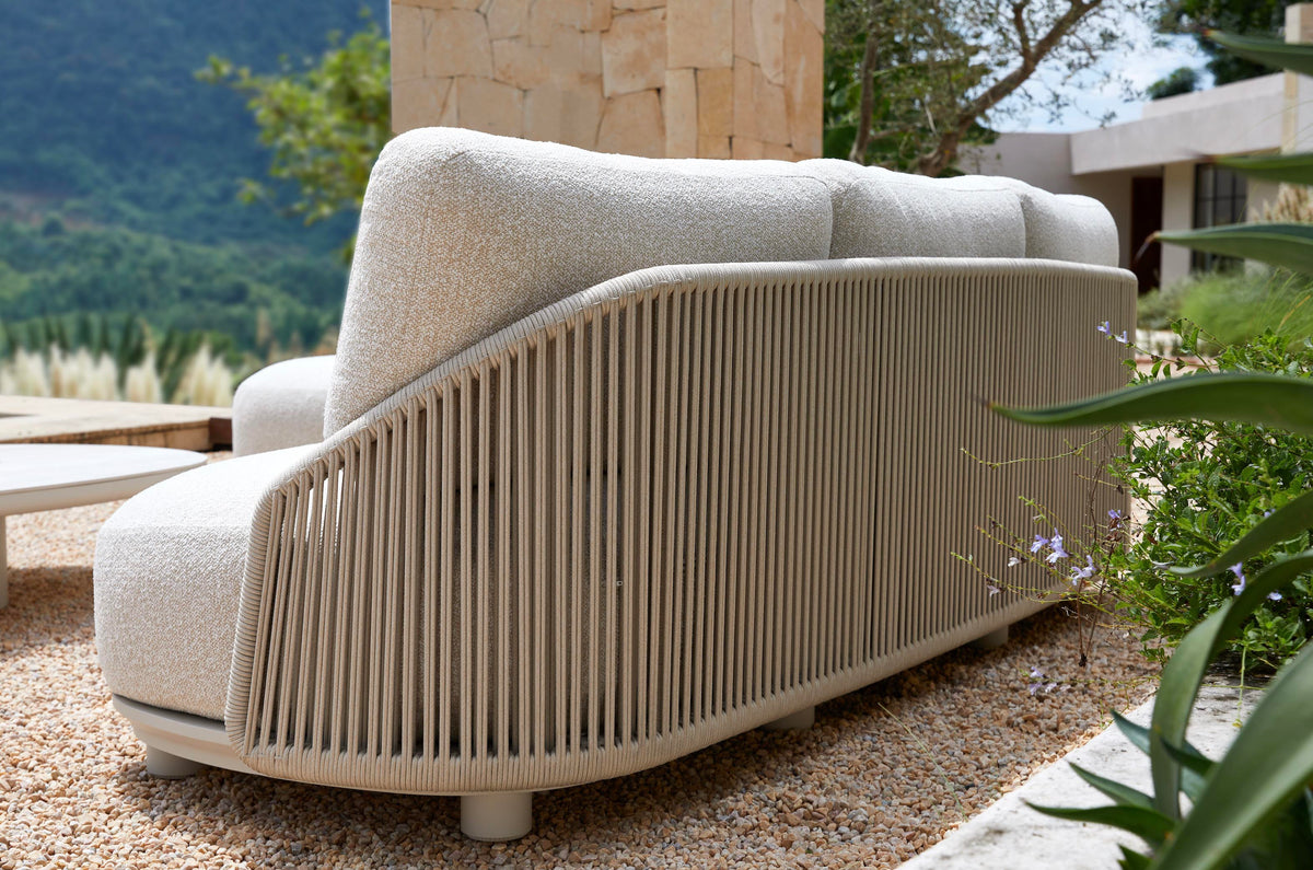 Aura beige rope outdoor lounge set with free-form ceramic coffee table – shown outdoors (5)