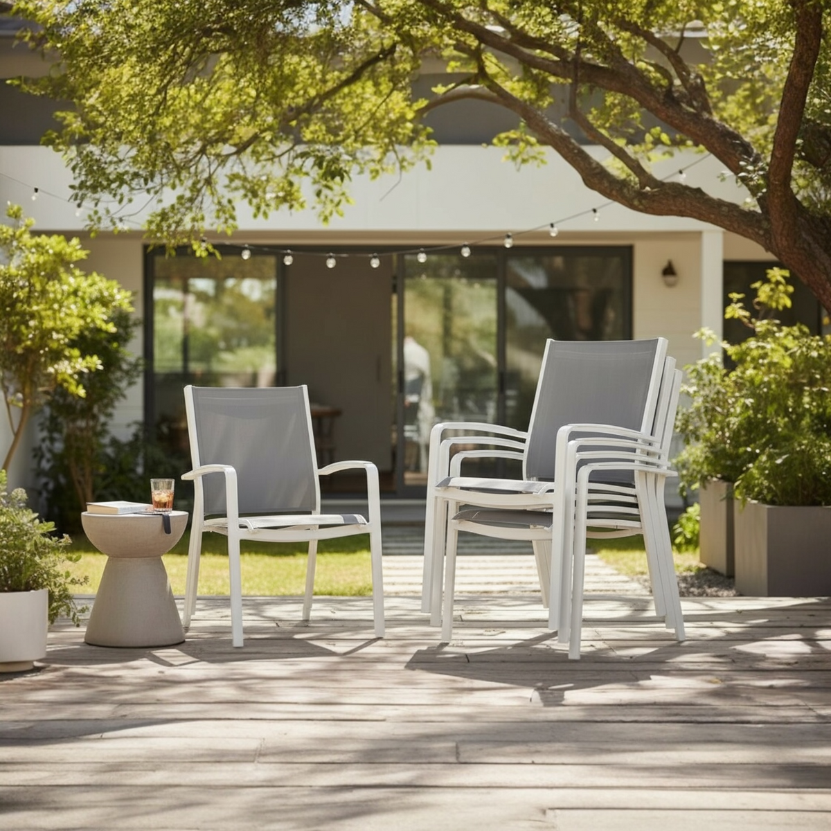 Nory Plus white stackable aluminum dining armchairs, set of 6 – shown outdoors
