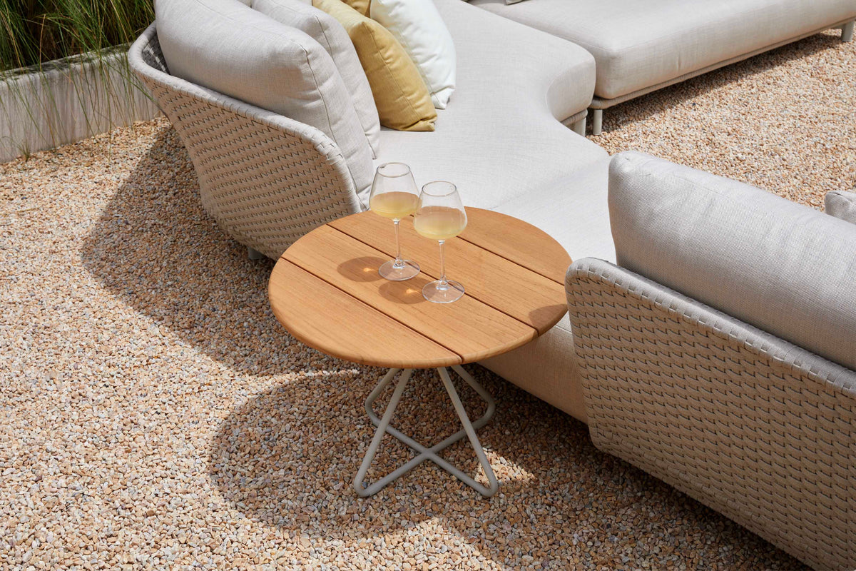 Charly rounded rope outdoor sectional with coffee and side tables – shown outdoors (9)