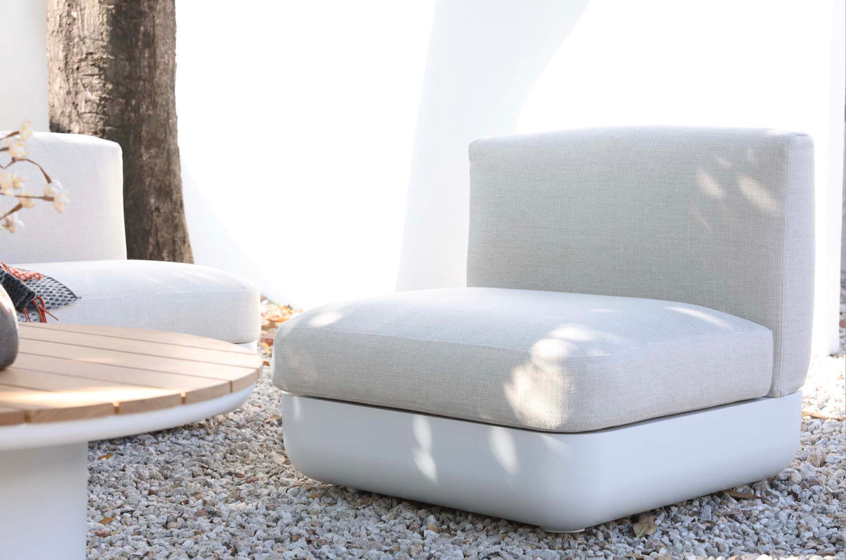 Mae curved white aluminum patio set with teak-top coffee table – shown outdoors (2)