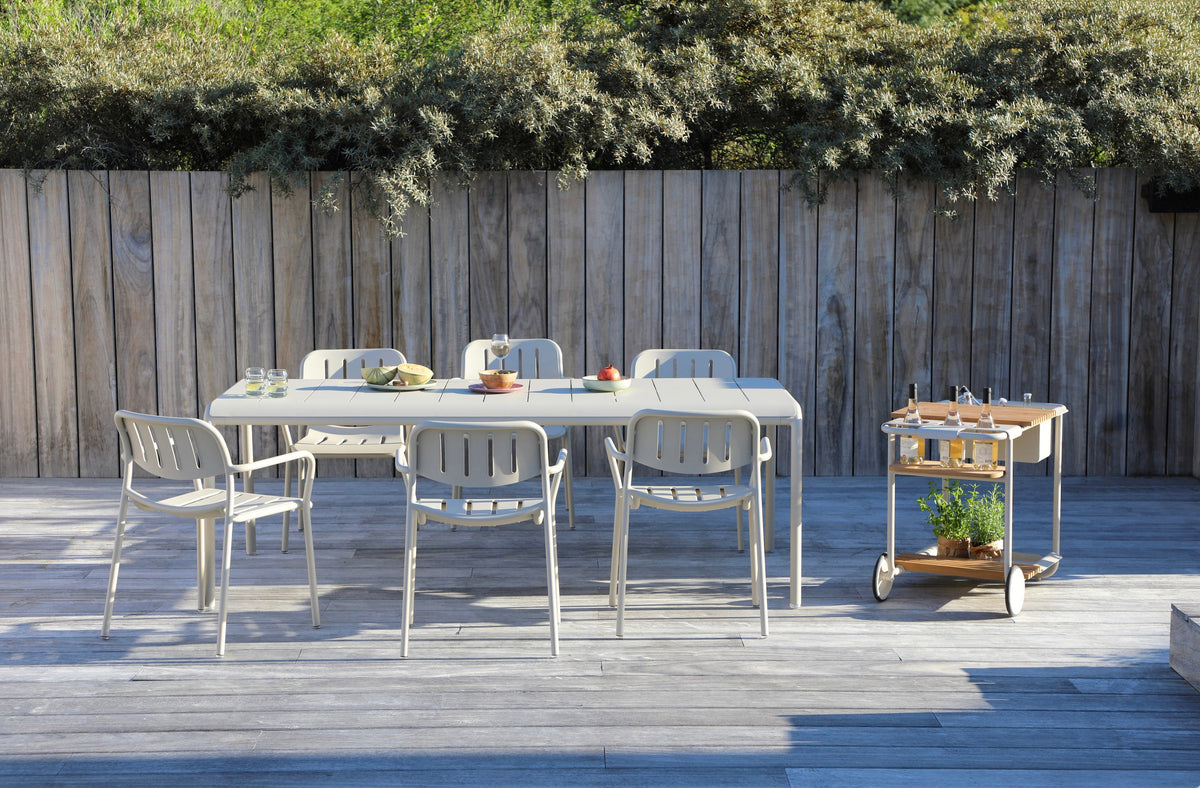 Sunny beige aluminum outdoor bar cart with cooler and teak trays – shown outdoors (2)