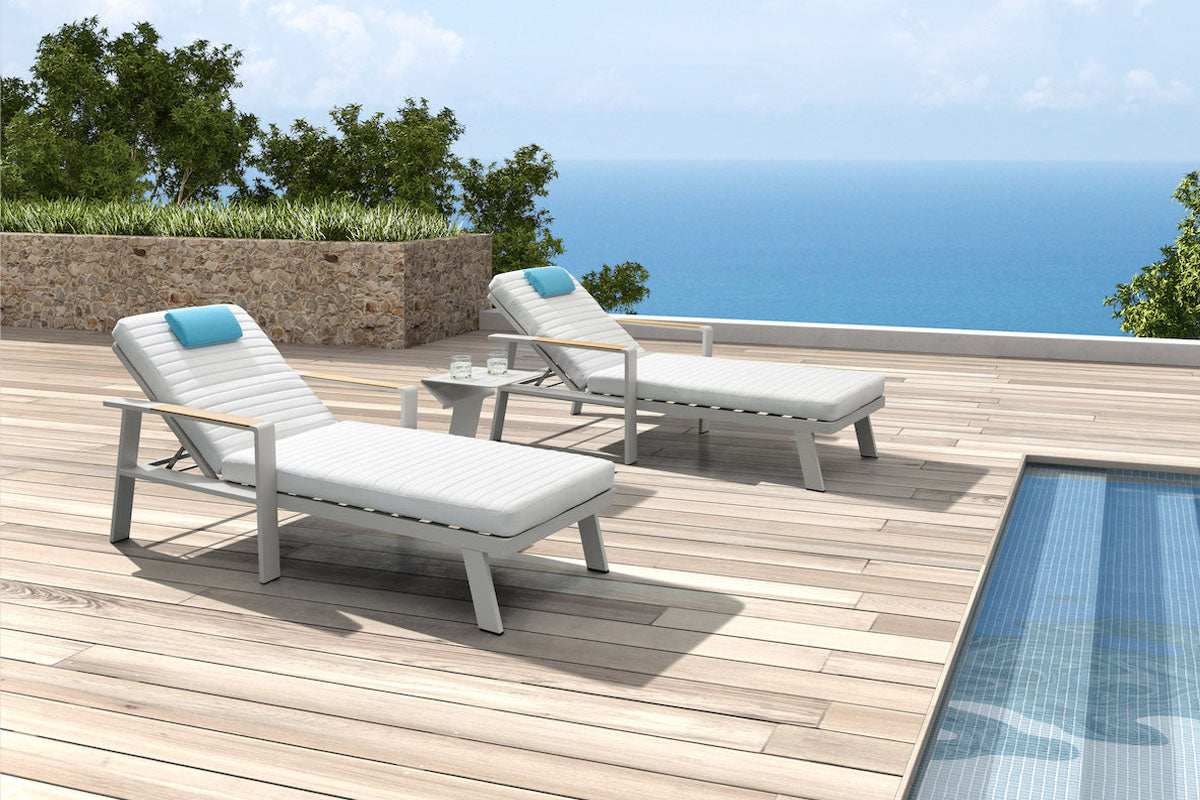 Noffy beige aluminum chaise lounge set of two with side table – shown outdoors (4)