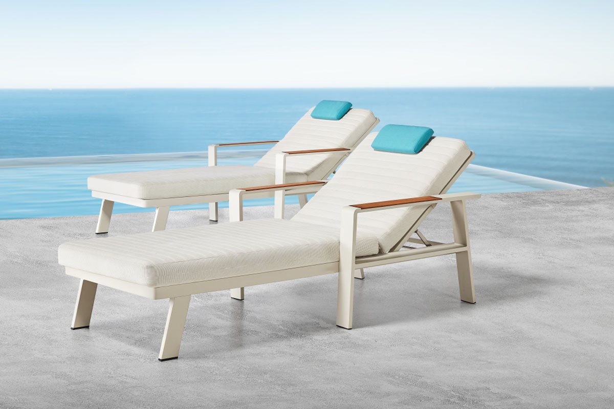 Noffy beige aluminum chaise lounge set of two with side table – shown outdoors (5)